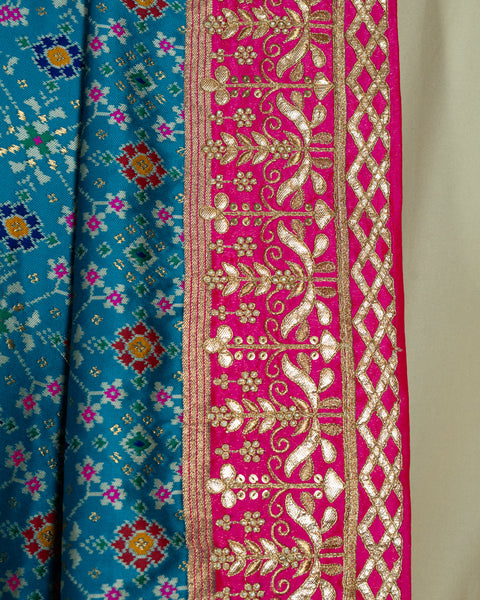 Elegant Sky Blue Patola Saree with Contrast Pink Border