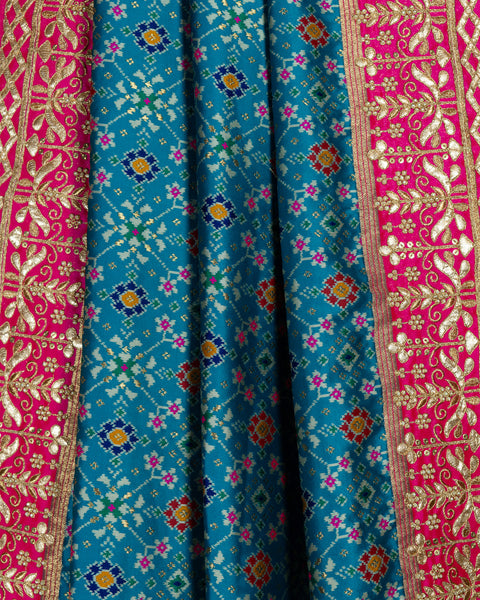 Elegant Sky Blue Patola Saree with Contrast Pink Border