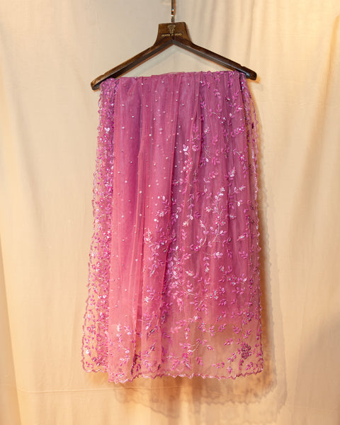 Radiant Pink Net Saree: A Blend of Opulence and Elegance