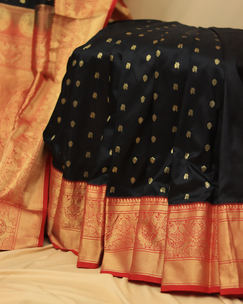 Majestic Black Kanjivaram Saree with Red Zari Border and Golden Dots